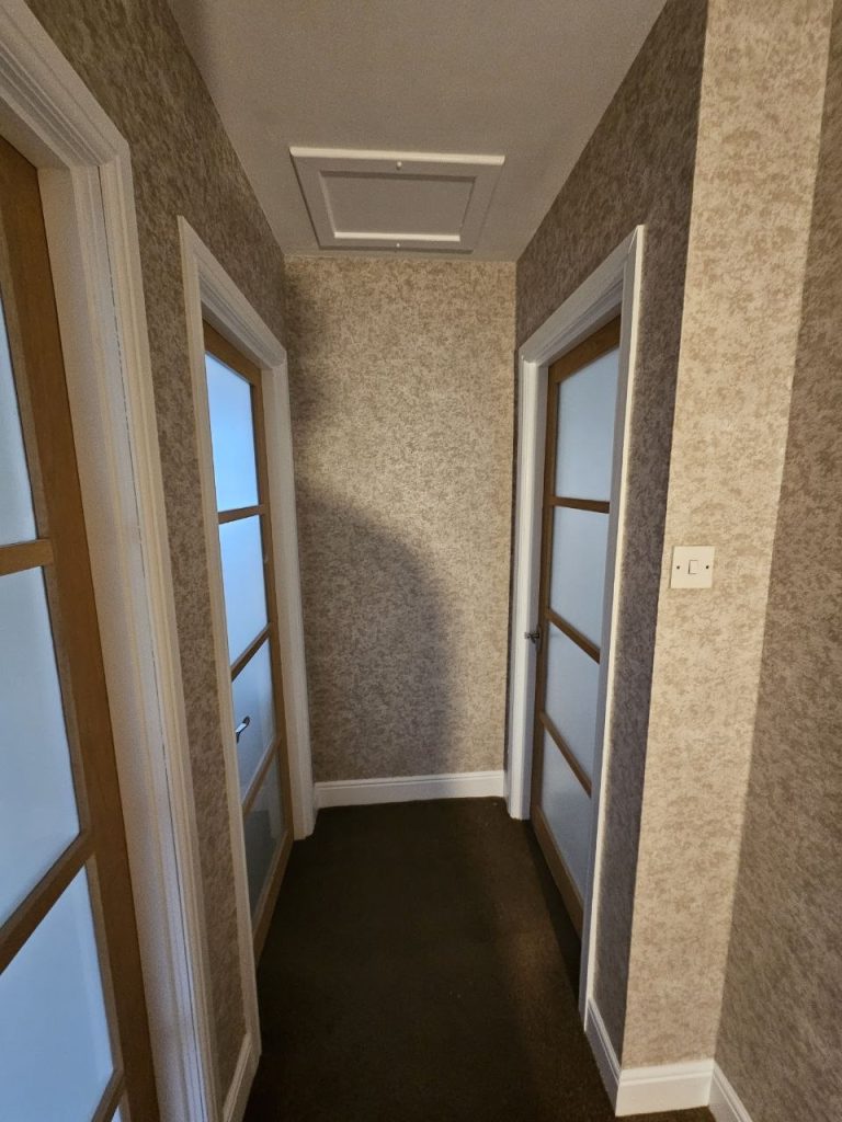 top landing in hallway wallpaered and painted, ceiling painted